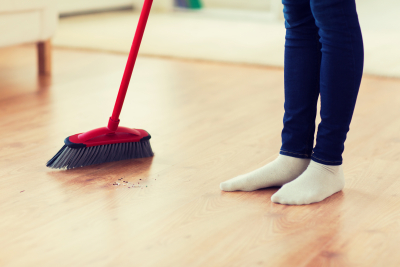woman sweeping the floor