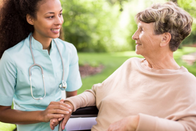 Senior and doctor in the garden